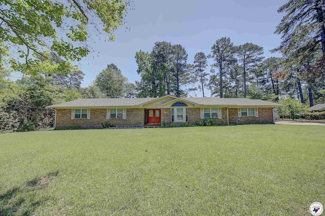 ranch-style home featuring a front yard