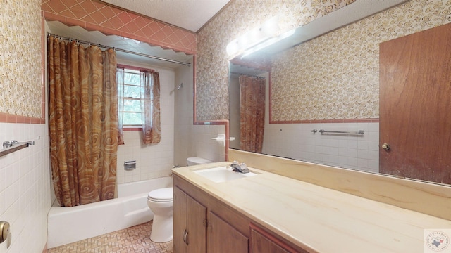 full bathroom featuring vanity, toilet, tile patterned floors, and tile walls