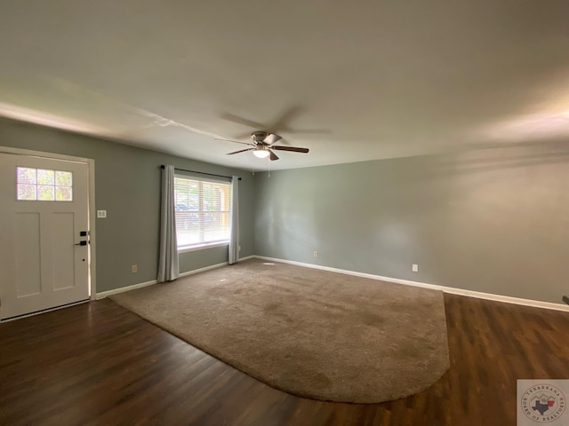 foyer with ceiling fan and dark hardwood / wood-style floors