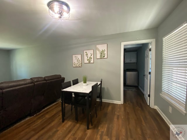 dining space featuring dark hardwood / wood-style floors