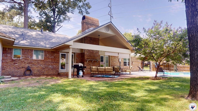 6010 Shadyside Ln, Texarkana, TX 75503 - rear view of house featuring brick siding, a chimney, an outdoor living space, and a patio area