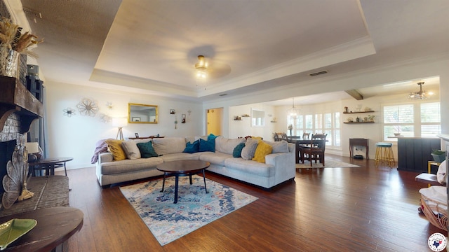 6010 Shadyside Ln, Texarkana, TX 75503 - living room with a raised ceiling, a large fireplace, dark wood-style floors, ceiling fan, and ornamental molding