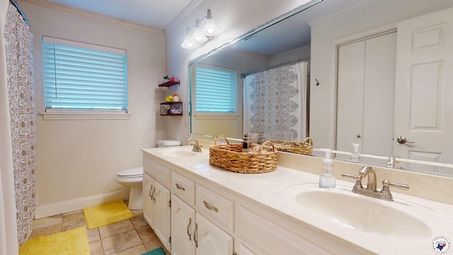 6010 Shadyside Ln, Texarkana, TX 75503 - bathroom with ornamental molding, double vanity, baseboards, toilet, and tile patterned flooring