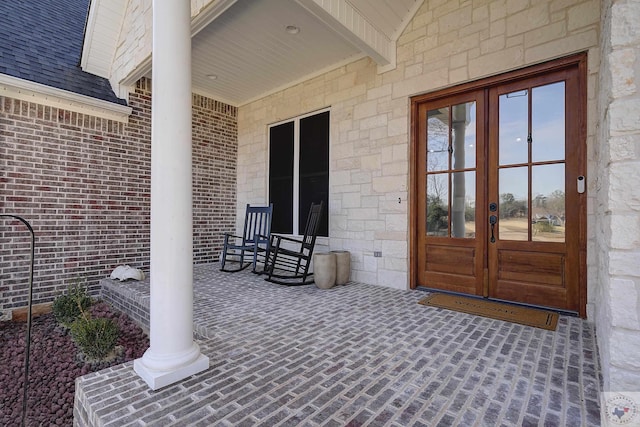 view of patio with french doors and covered porch