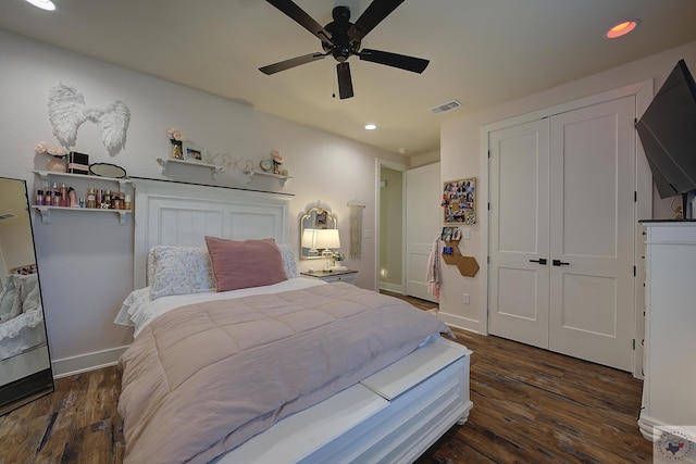 bedroom featuring ceiling fan, dark hardwood / wood-style flooring, and a closet