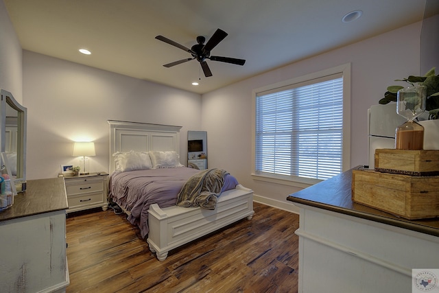 bedroom featuring ceiling fan and dark hardwood / wood-style floors