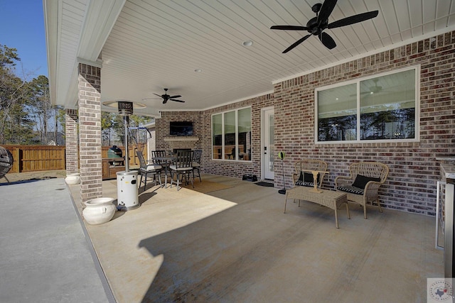 view of patio featuring ceiling fan