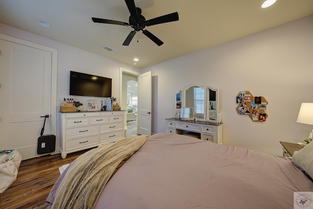 bedroom with ceiling fan and dark hardwood / wood-style floors