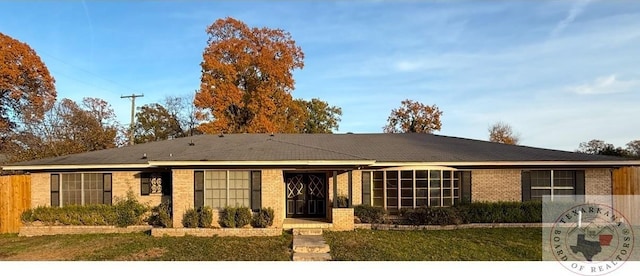 ranch-style house with a front yard