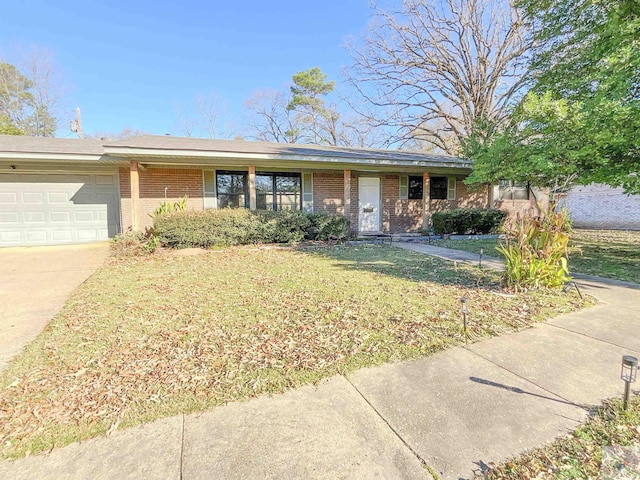 ranch-style home with a garage and a front lawn