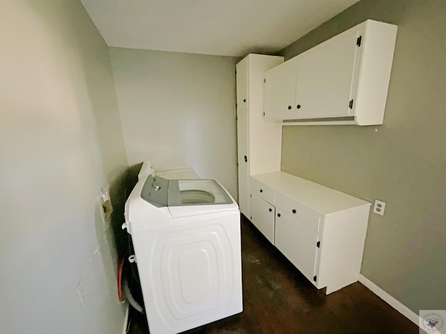 washroom with cabinets and washer and clothes dryer