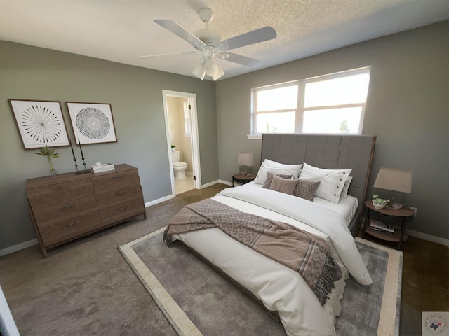 carpeted bedroom with ceiling fan, a textured ceiling, and ensuite bath