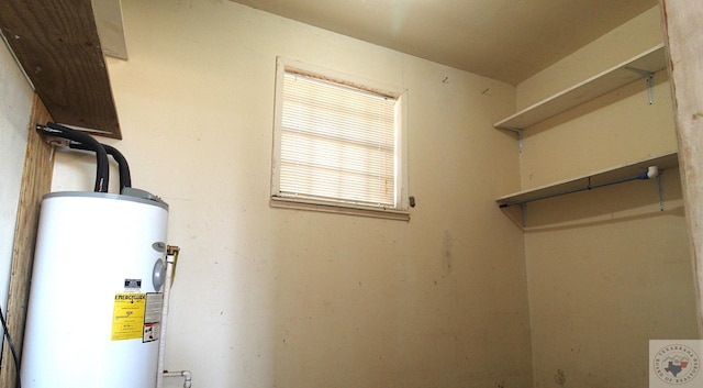 utility room featuring water heater