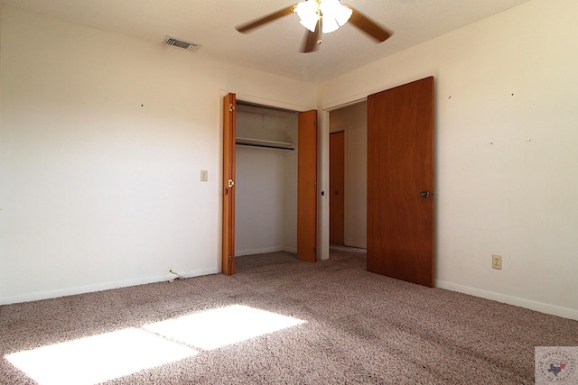 unfurnished bedroom with ceiling fan, a closet, and carpet floors