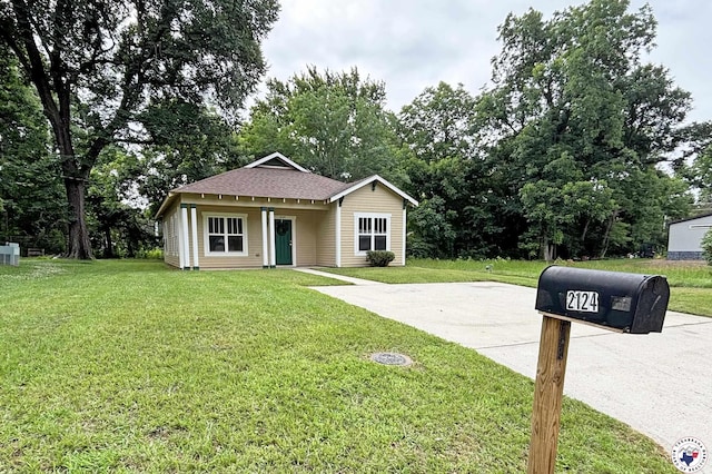 2124 Stevenson St, Texarkana, TX 75501 - view of front of home featuring a front yard and roof with shingles