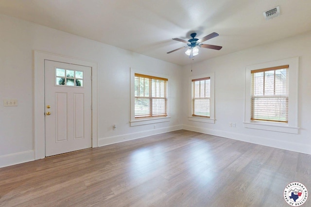 2124 Stevenson St, Texarkana, TX 75501 - foyer with healthy amount of natural light, wood finished floors, and a ceiling fan