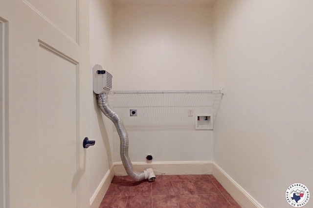 2124 Stevenson St, Texarkana, TX 75501 - laundry room featuring hookup for an electric dryer, hookup for a washing machine, and tile patterned flooring