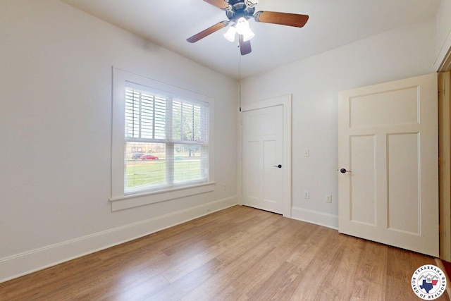2124 Stevenson St, Texarkana, TX 75501 - unfurnished bedroom featuring light wood-style flooring and a ceiling fan