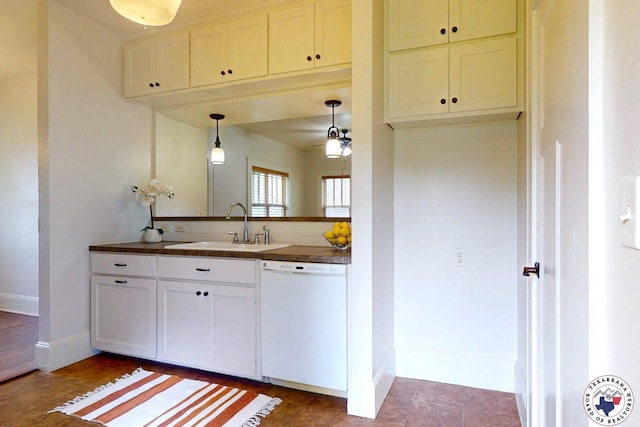 2124 Stevenson St, Texarkana, TX 75501 - kitchen featuring white dishwasher, dark countertops, ceiling fan, and white cabinetry