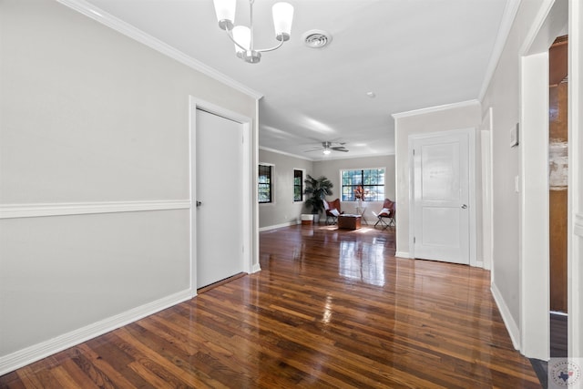 interior space with a notable chandelier, crown molding, and dark wood-type flooring