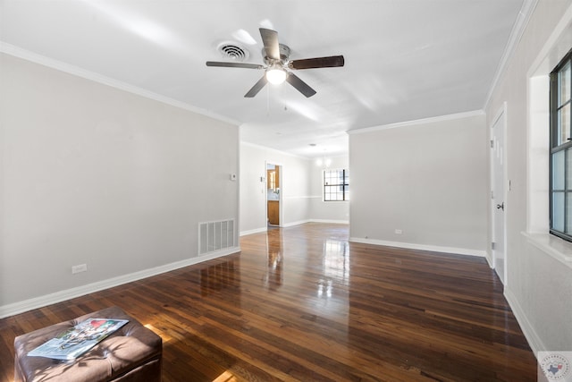 interior space with dark wood-type flooring, ceiling fan, and ornamental molding