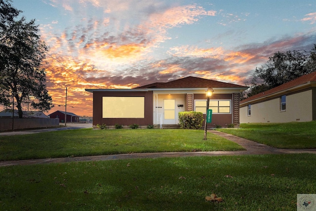 view of front of house with a lawn