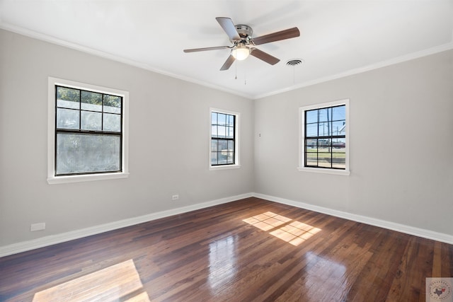 spare room featuring dark hardwood / wood-style floors, ceiling fan, and ornamental molding