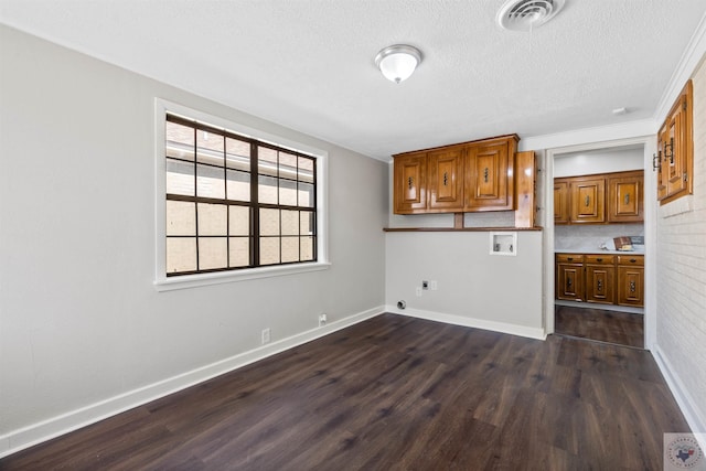 interior space with dark hardwood / wood-style floors and a textured ceiling