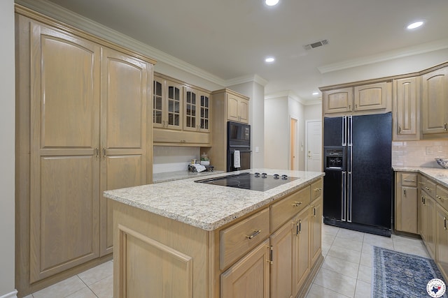 1305 Centerhill Rd, Linden, TX 75563 - kitchen with black appliances, a kitchen island, light tile patterned floors, light brown cabinets, and recessed lighting
