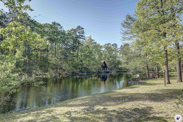 view of water feature with a forest view