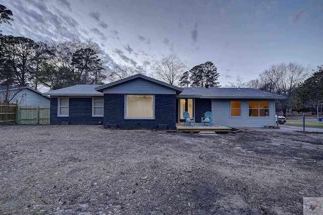 ranch-style house with a wooden deck