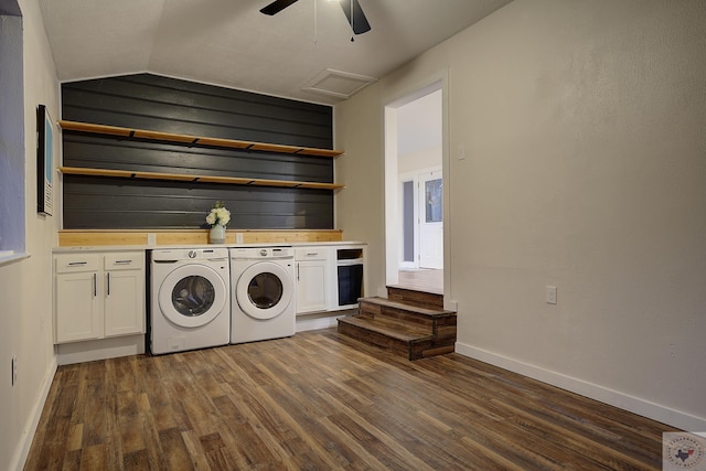 laundry area featuring ceiling fan, cabinets, dark hardwood / wood-style floors, and washing machine and dryer