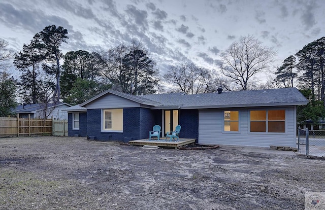 back of house with a wooden deck