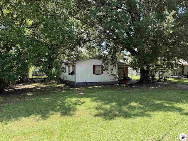 1003 Brooks, New Boston, TX 75570 - view of side of property featuring a lawn