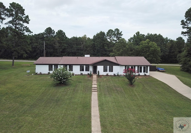 ranch-style house with a front lawn