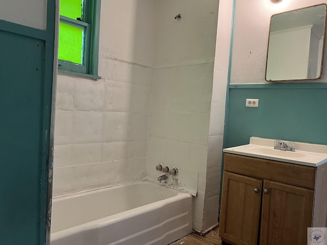 bathroom featuring a ceiling fan and vanity