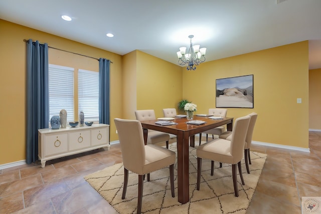 dining space featuring an inviting chandelier, recessed lighting, and baseboards