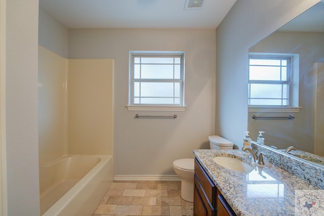 full bathroom featuring vanity, toilet, plenty of natural light, and shower / tub combination