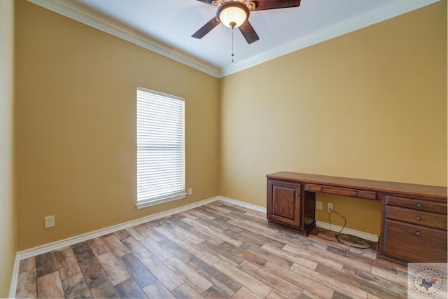 unfurnished office with light wood-type flooring, ceiling fan, a healthy amount of sunlight, and crown molding