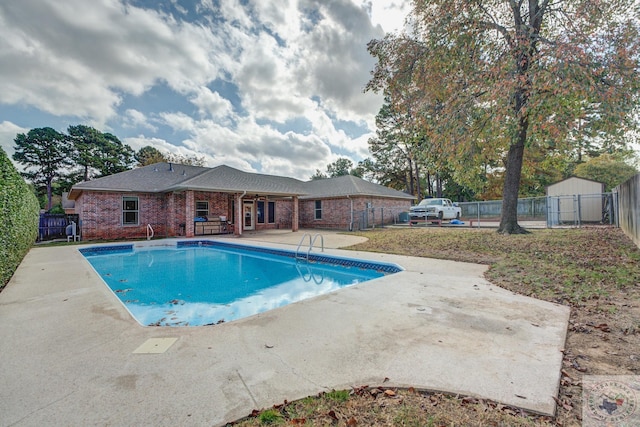 view of swimming pool with a patio area