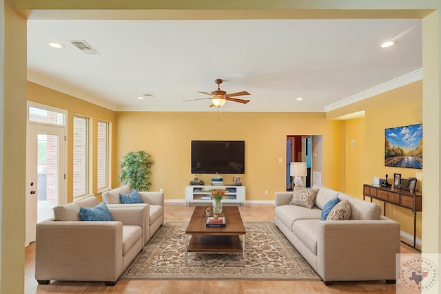 living room featuring ceiling fan and crown molding