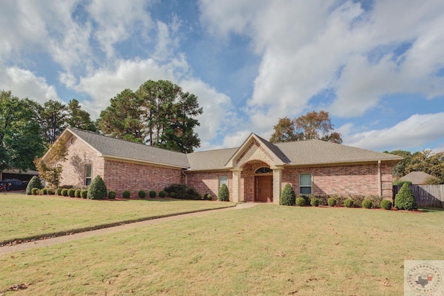 ranch-style house with a front lawn