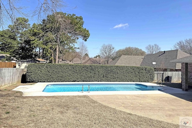 view of swimming pool featuring a patio area, a fenced backyard, and a fenced in pool