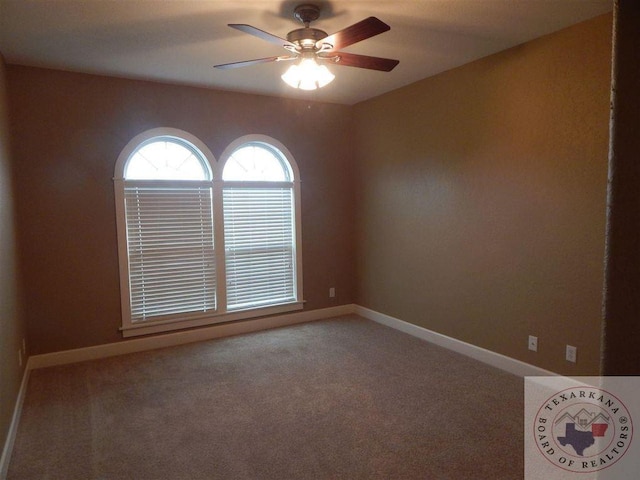 empty room featuring ceiling fan and carpet flooring