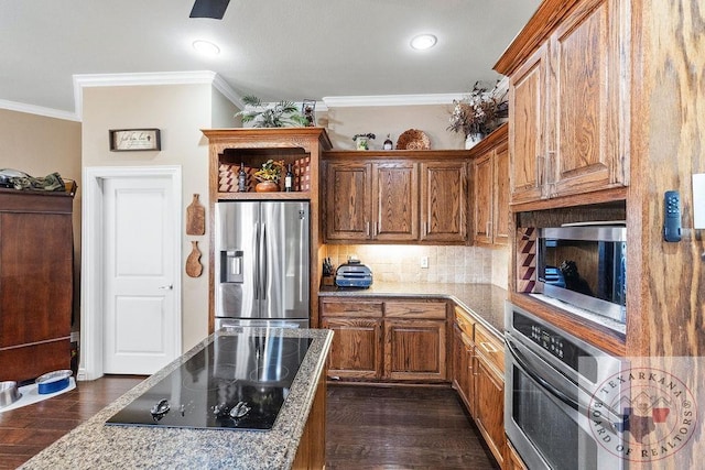 9891 County Rd 2422, Royse City, TX 75189 - kitchen featuring dark hardwood / wood-style flooring, light stone counters, ornamental molding, decorative backsplash, and stainless steel appliances