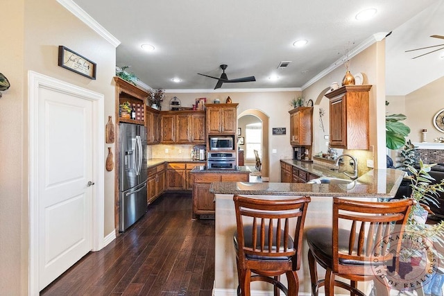 9891 County Rd 2422, Royse City, TX 75189 - kitchen featuring kitchen peninsula, ceiling fan, sink, dark wood-type flooring, and stainless steel appliances
