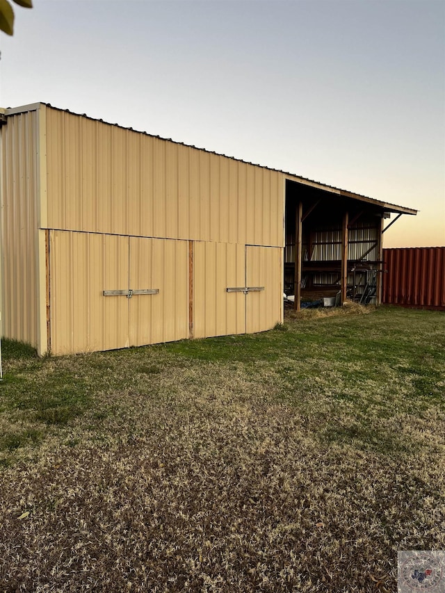 9891 County Rd 2422, Royse City, TX 75189 - outdoor structure at dusk featuring a lawn