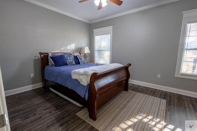 bedroom featuring crown molding, dark wood-type flooring, multiple windows, and ceiling fan