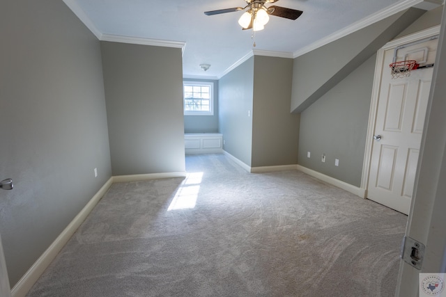 additional living space featuring ceiling fan and light colored carpet