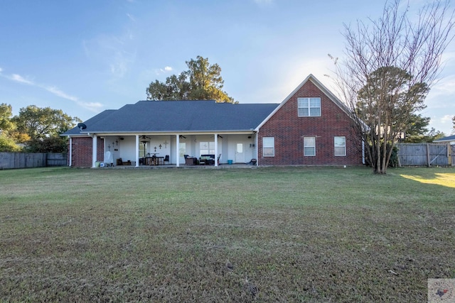 view of front of house with a front lawn and a patio